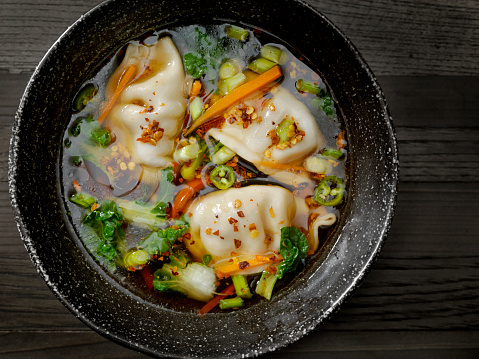 Asian Style Pork Dumpling Soup with Carrots, Bok Choy, Peppers and Green Onion