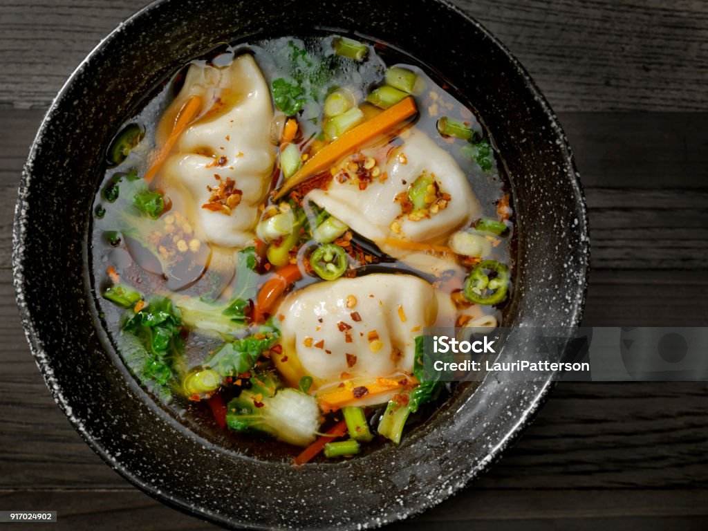 Asian Style Pork Dumpling Soup Asian Style Pork Dumpling Soup with Carrots, Bok Choy, Peppers and Green Onion Soup Stock Photo