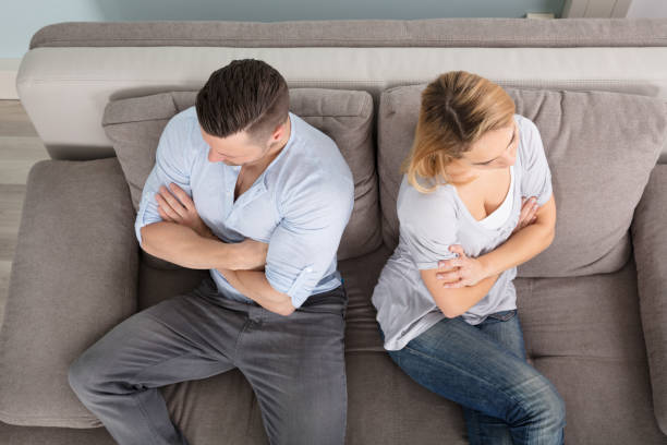 istock Upset Couple Sitting On Couch 917034014