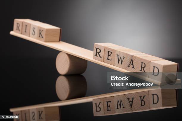 Seesaw Showing Imbalance Between Risk And Reward Stock Photo - Download Image Now - Risk, Incentive, Organization