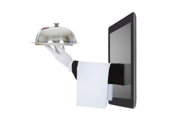 istock Waiter's Hand Coming Out From The Digital Tablet 917037240