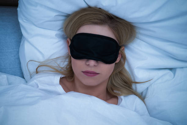 Young Woman Sleeping With Eye Mask Young Woman Sleeping With Eye Mask sleep eye mask stock pictures, royalty-free photos & images