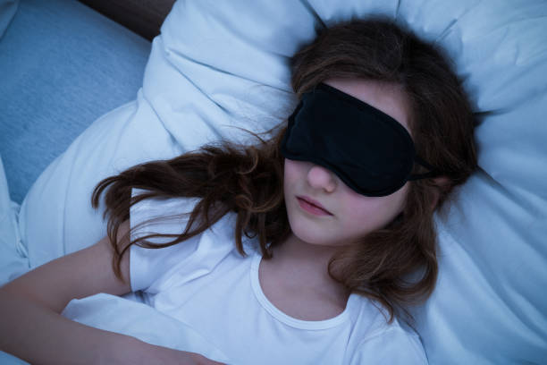 istock Girl Sleeping With Eye Mask 917037430