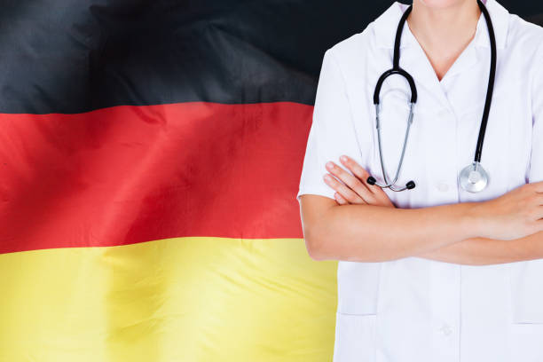 istock Doctor Standing Against German Flag 917037448