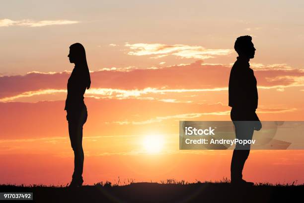 Couple Silhouette Standing Away From Each Other Stock Photo - Download Image Now - Separation, Relationship Breakup, Divorce