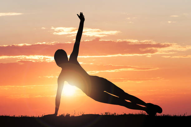 Silhouette Of A Person Exercising Silhouette Of A Person Exercising yoga stock pictures, royalty-free photos & images