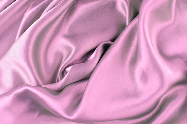 Gently pink satin waves texture stock photo