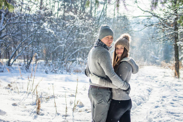 istock Couple hugs in winter forest 917052432