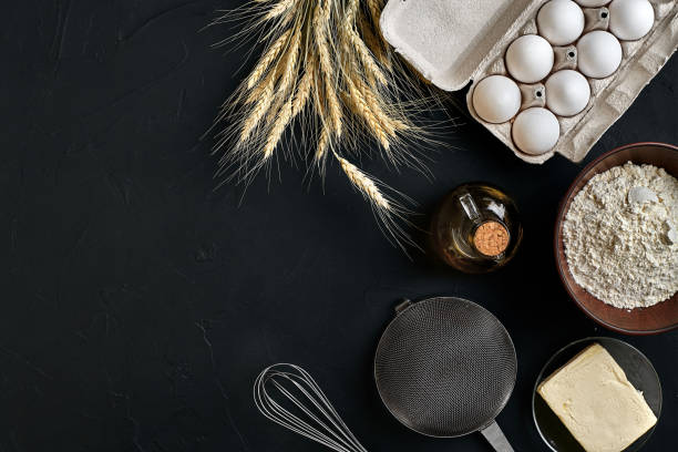 istock Dough preparation recipe bread, pizza or pie making ingredients, food flat lay on kitchen table background. Working with butter, yeast, flour, eggs, oil. Pastry or bakery cooking 917053444