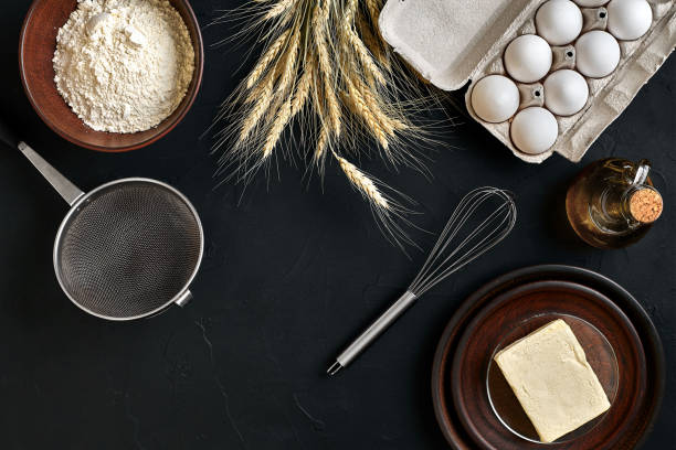istock Dough preparation recipe bread, pizza or pie making ingredients, food flat lay on kitchen table background. Working with butter, yeast, flour, eggs, oil. Pastry or bakery cooking 917053846