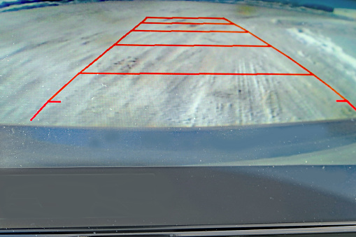 Rear view camera image on car dashboard showing everything clear behind the car.