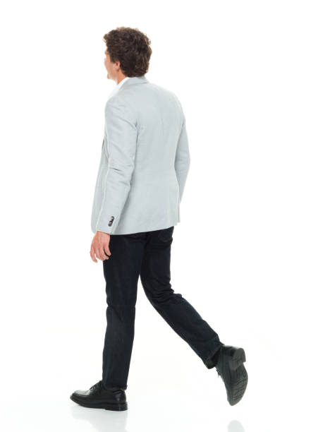 istock Businessman in smart casual clothes walking 917059428