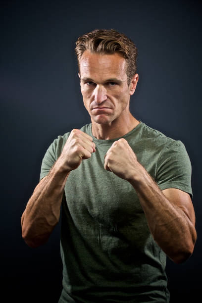 istock Male arms and hands raised to fight 917063944