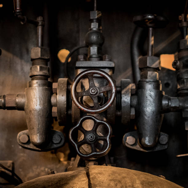 old  technology concept - valves, taps and pipes closeup -