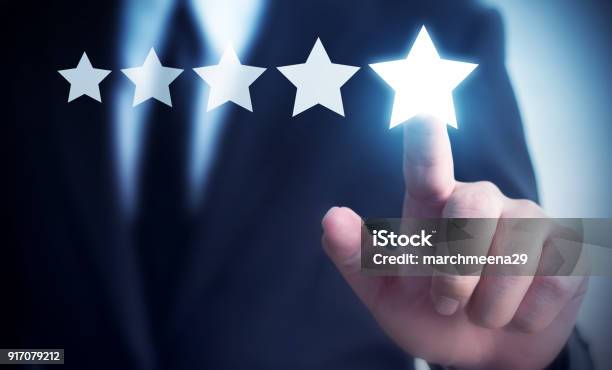 Businessman Hand Touching Five Star Symbol To Increase Rating Of Company Concept Copy Space Background For Your Title Stock Photo - Download Image Now