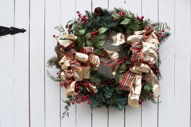 istock Wreath on white wood door 917087918