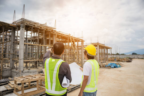 istock Asian business man construction engineer workers at house building site 917088736