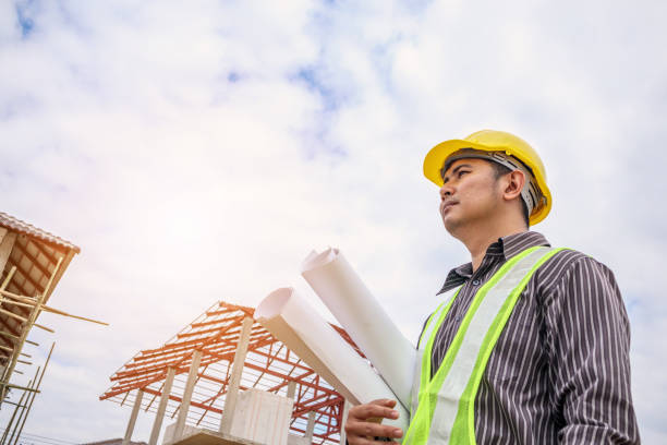 istock Asian business man construction engineer worker at house building site 917088742