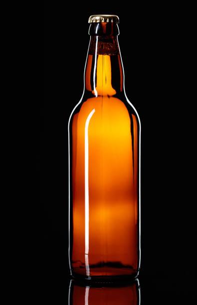 istock Closed bottle of beer on a black background. 917093724