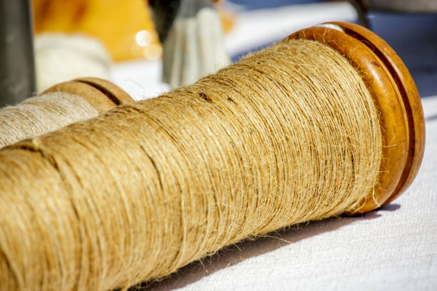 istock Jute twine roll on white cloth under sunny day 917093810