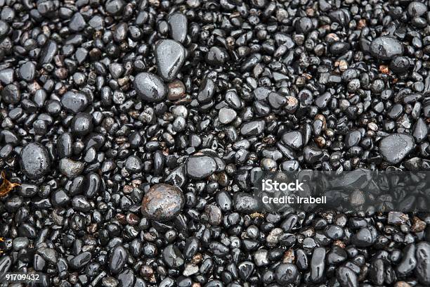 Wet Sea Pebbles On A Beach Close Up Stock Photo - Download Image Now - Backgrounds, Beach, Boulder - Rock