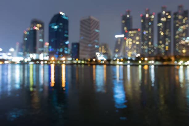 istock Blurred bokeh city building light water front 917096412