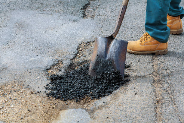 istock Road construction. New asphalt concrete, concrete kerb and orange safety 917099360