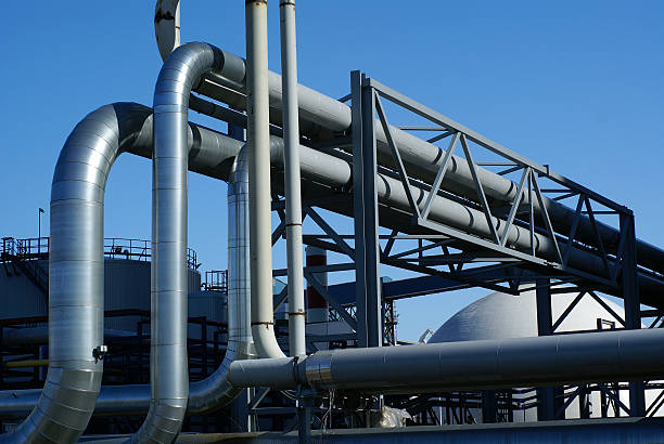 istock industrial pipelines and storage tanks against blue sky 91710779