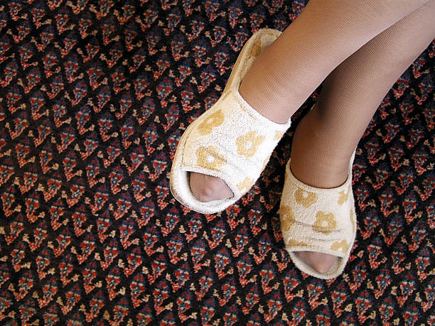 ноги - slipper senior adult shoe human leg стоковые фото и изображения