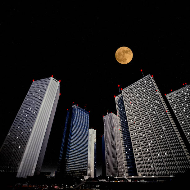 istock Full moon rising over the skyscraper 917116946
