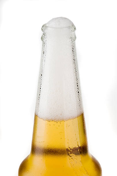 istock Top part of beer bottle with froth 91712064