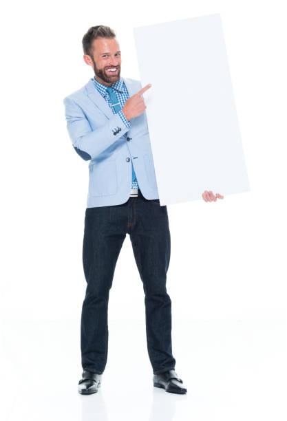 istock Attractive businessman holding white sign 917122466