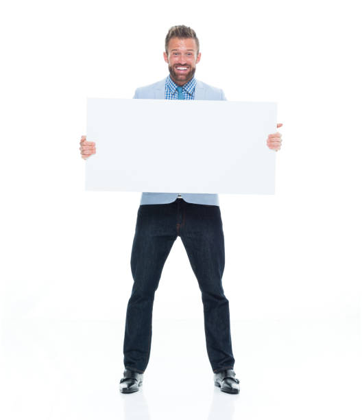 istock Attractive businessman holding white sign 917122556