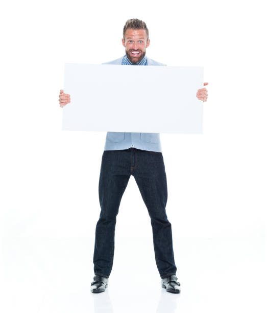 istock Attractive businessman holding white sign 917122588