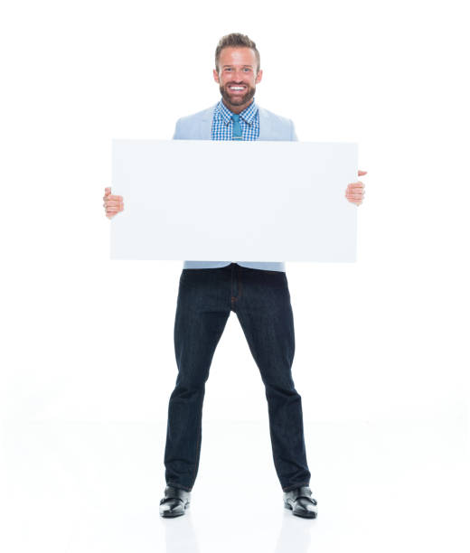 istock Attractive businessman holding white sign 917122612