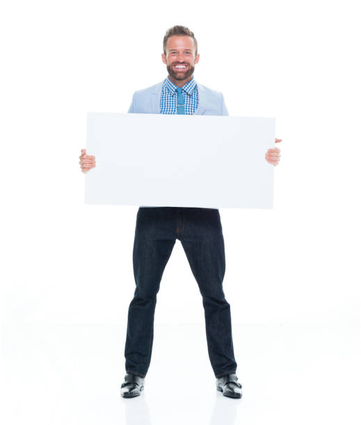 istock Attractive businessman holding white sign 917122614