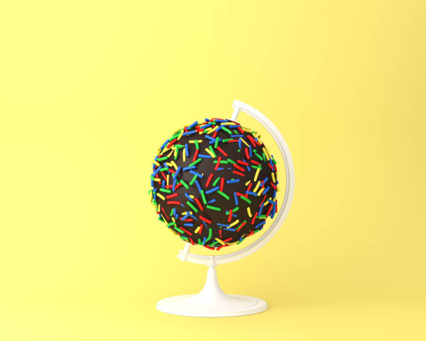 istock Globe sphere orb chocolate sweets concept on pastel yellow background. minimal idea concept. An idea creative to produce work within an advertising marketing communications or artwork design. 917122918