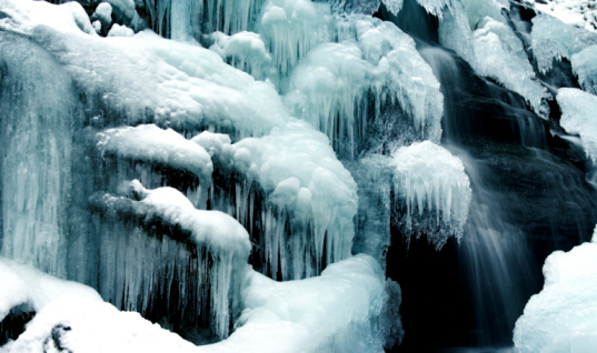 Snow and ice at Skaftafell waterfall in iceland, Vatnajokull national park