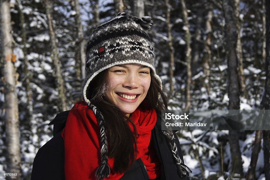 Girl in winter Young smiling xwoman in winter forest landscape, Quebec, Canada. For more: 20-29 Years Stock Photo