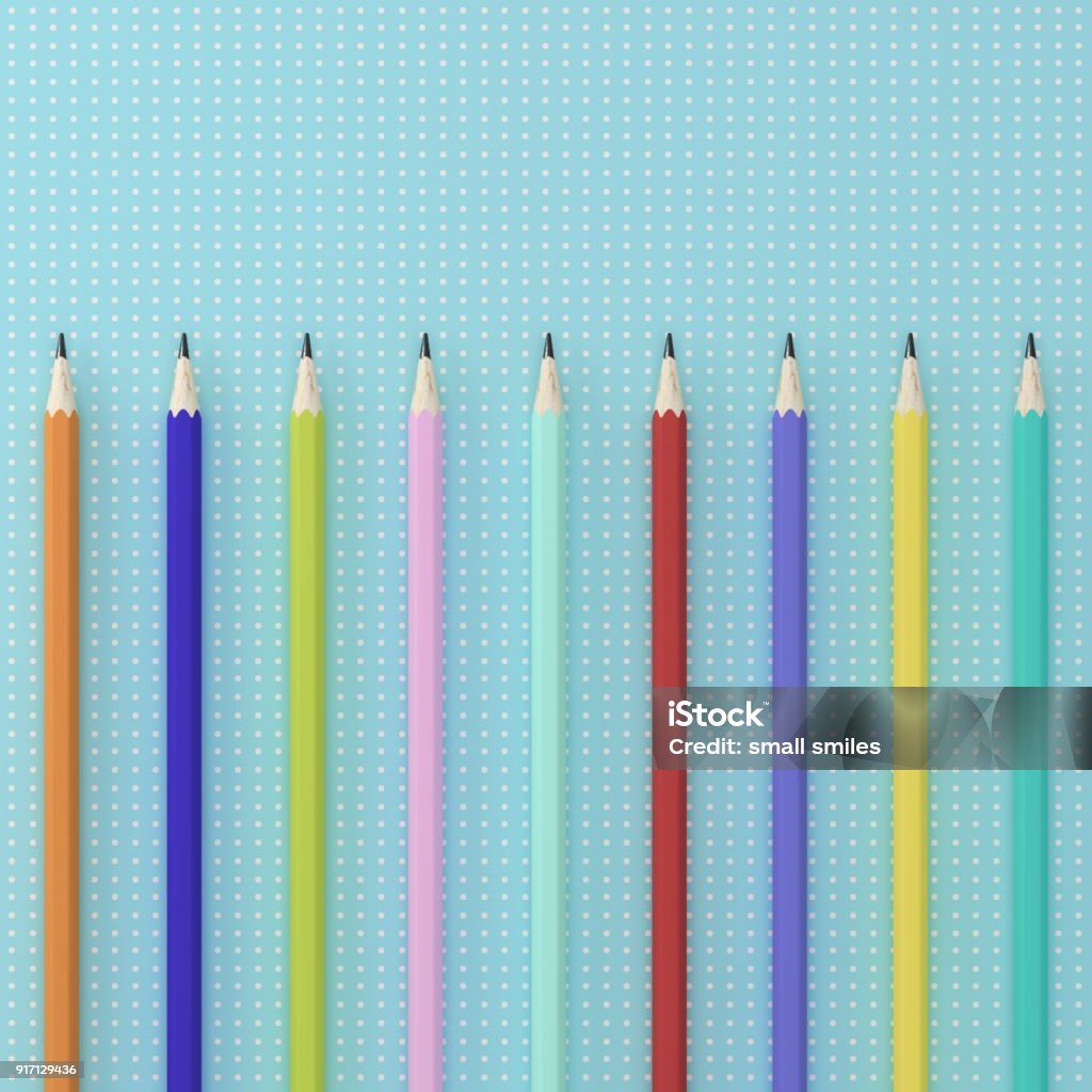 Create a submission in ESP. Finish it on your phone. Contributor by Getty Images. Available at iTunes or Google Play Top view of collection of colorful pencils on point pattern blue background desk for mockup. minimal creative concept. case study concept On Top Of Stock Photo