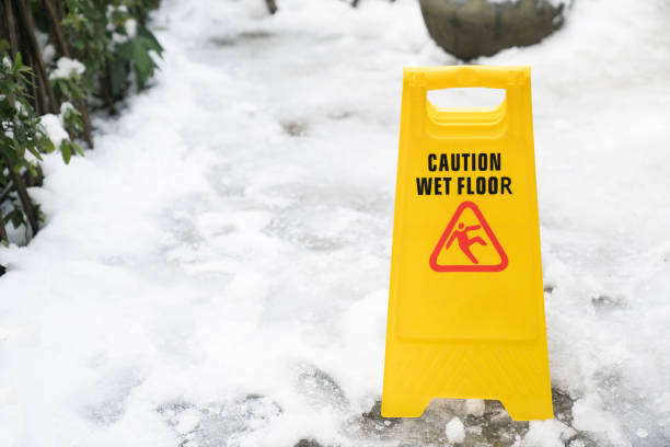 istock Warning sign for wet floor on snow background 917131888