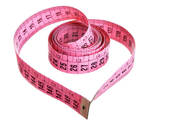 A Pink Tape Measure Creating A Heart Stock Photo - Download Image Now -  Heart Shape, Tape Measure, Centimeter - iStock