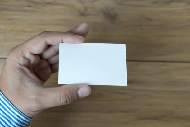 istock Hand hold blank white card mockup Business branding. 917139910