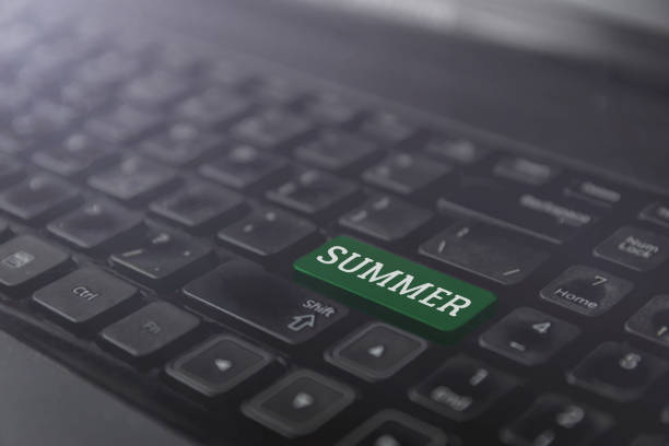 istock Laptop green keyboard button with word summer, rest time concept 917143564