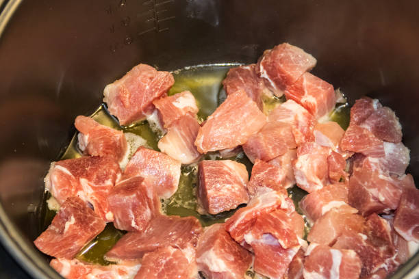 istock Chopped pork meat cooking in slow cooker 917143594