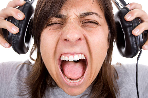 istock teenager shouting with headphones 91714595