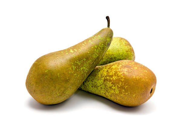 Group of pears in a white background Small group of pears (Conference) on white conference pear stock pictures, royalty-free photos & images