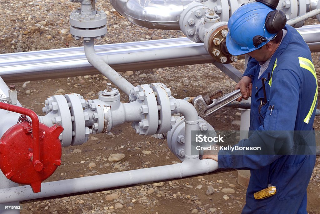 Operatore di produzione di Gas - Foto stock royalty-free di Oleodotto