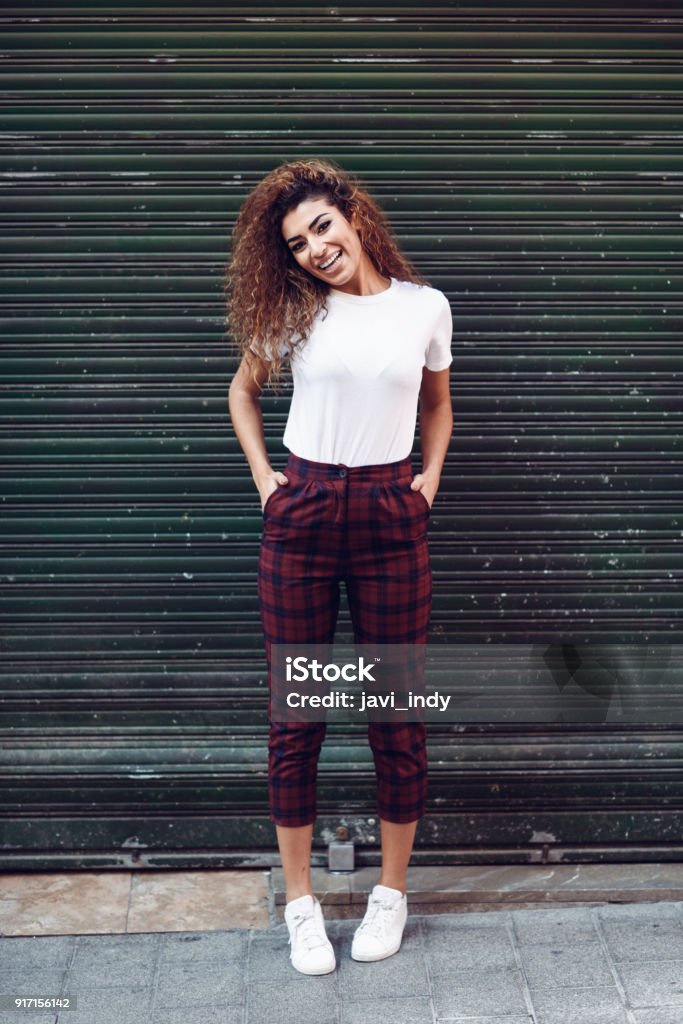 Smiling Arab Girl In Casual Clothes In The Street Stock Photo - Download  Image Now - Women, One Woman Only, T-Shirt - iStock
