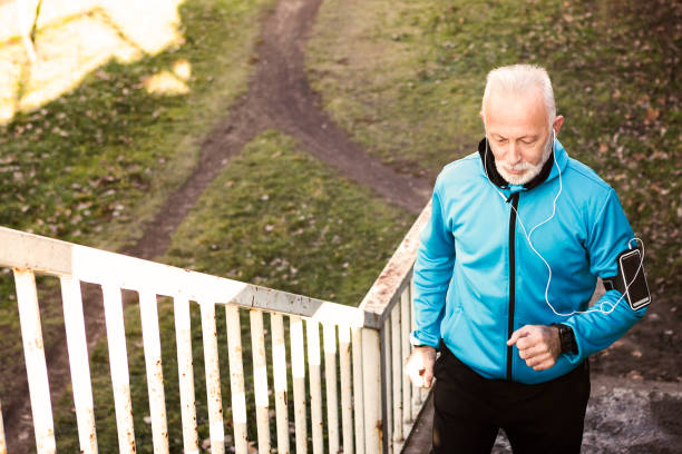 istock Senior man jogging on staircase 917159166
